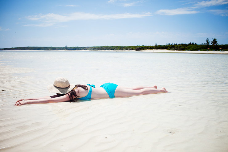 laying on the beach at cococay