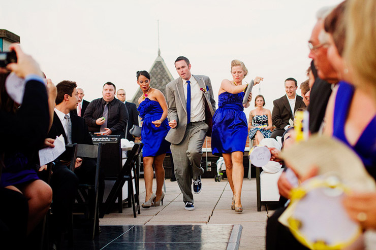 wedding party dancing down aisle