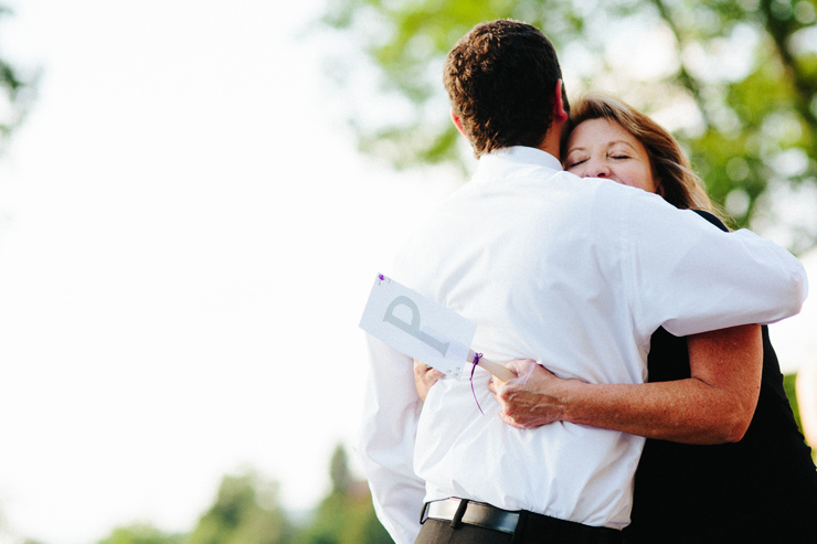 groom hugging mom