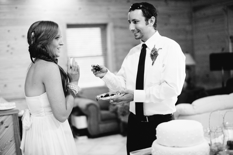 bride and groom feed each other cake