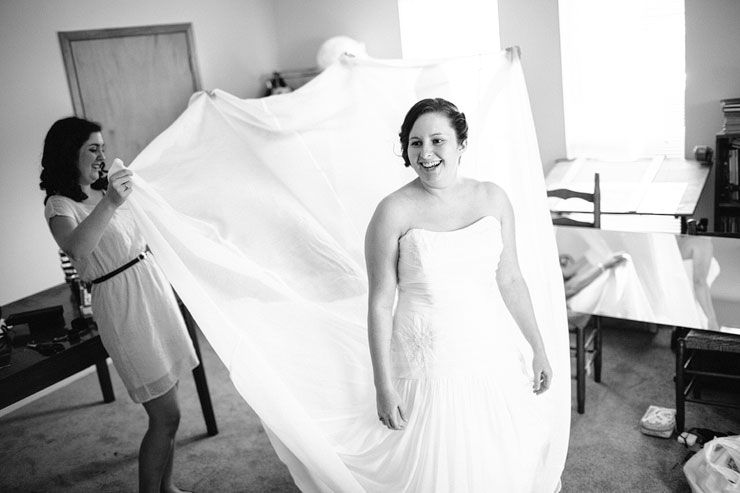 bride putting her dress on