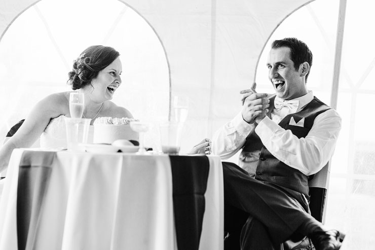 bride and groom laughing at the speeches