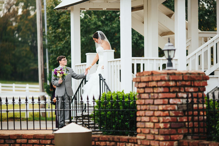 brother walking his sister down aisle