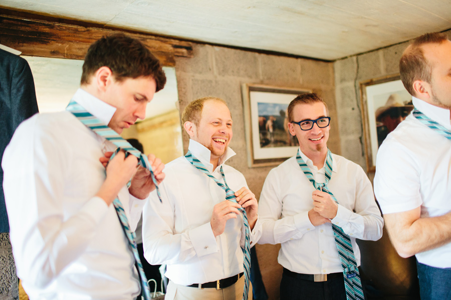 groom tying his tie