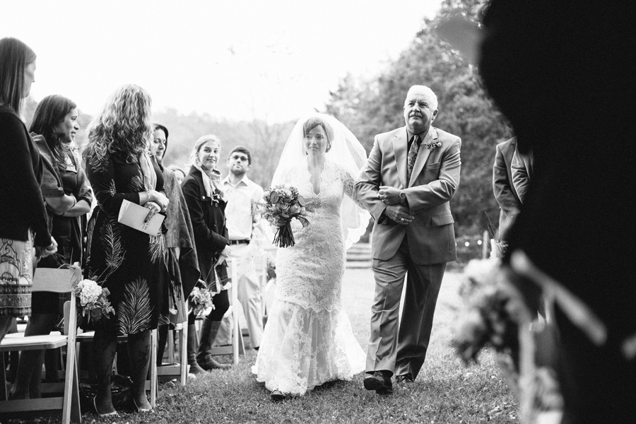 bride walking down aisle with dad