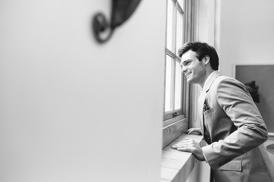 groom looks out at ceremony